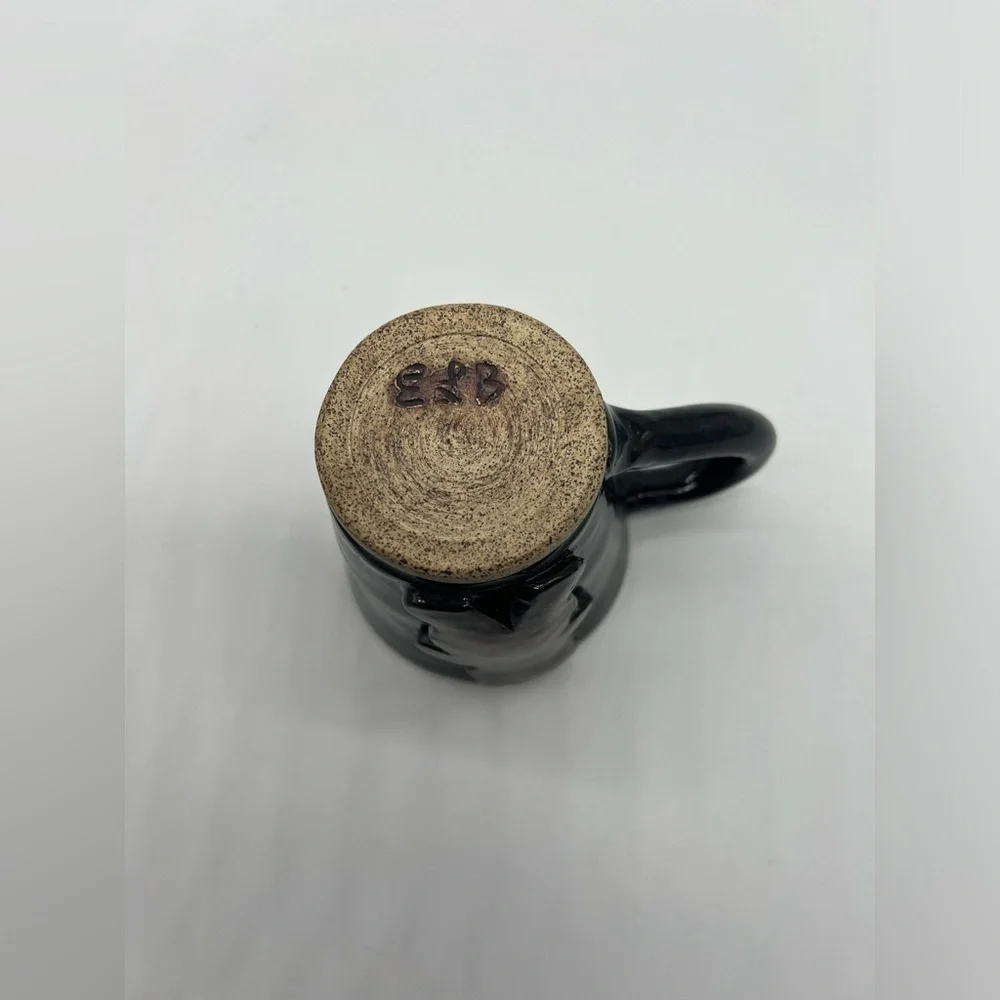 Handmade studio pottery mug with rustic bear design